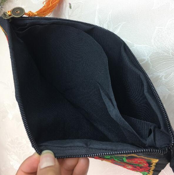 The Artisan's Bloom - Hand-Embroidered Cotton Hand Purse