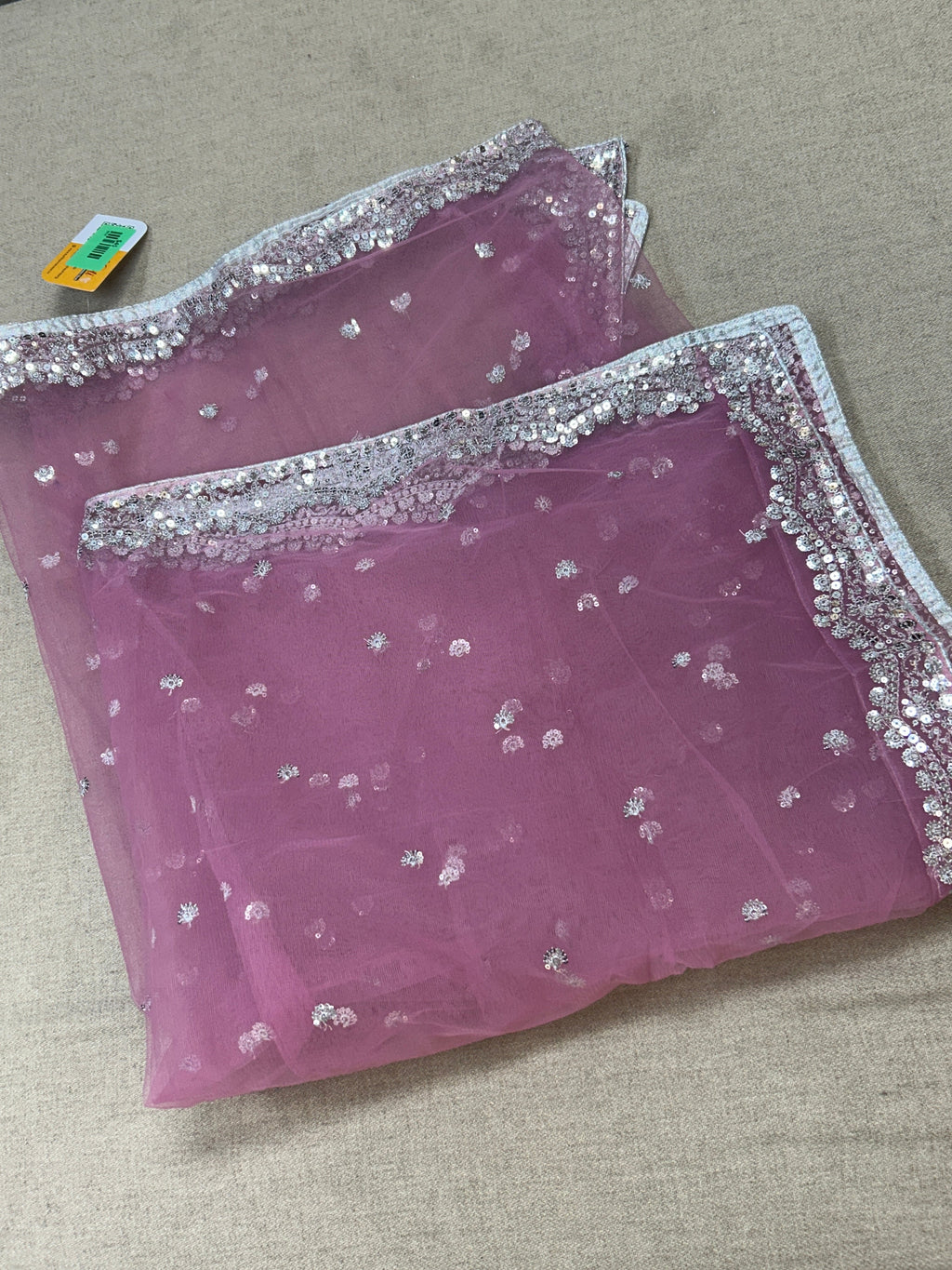 Light pink net dupatta with silver sequin border