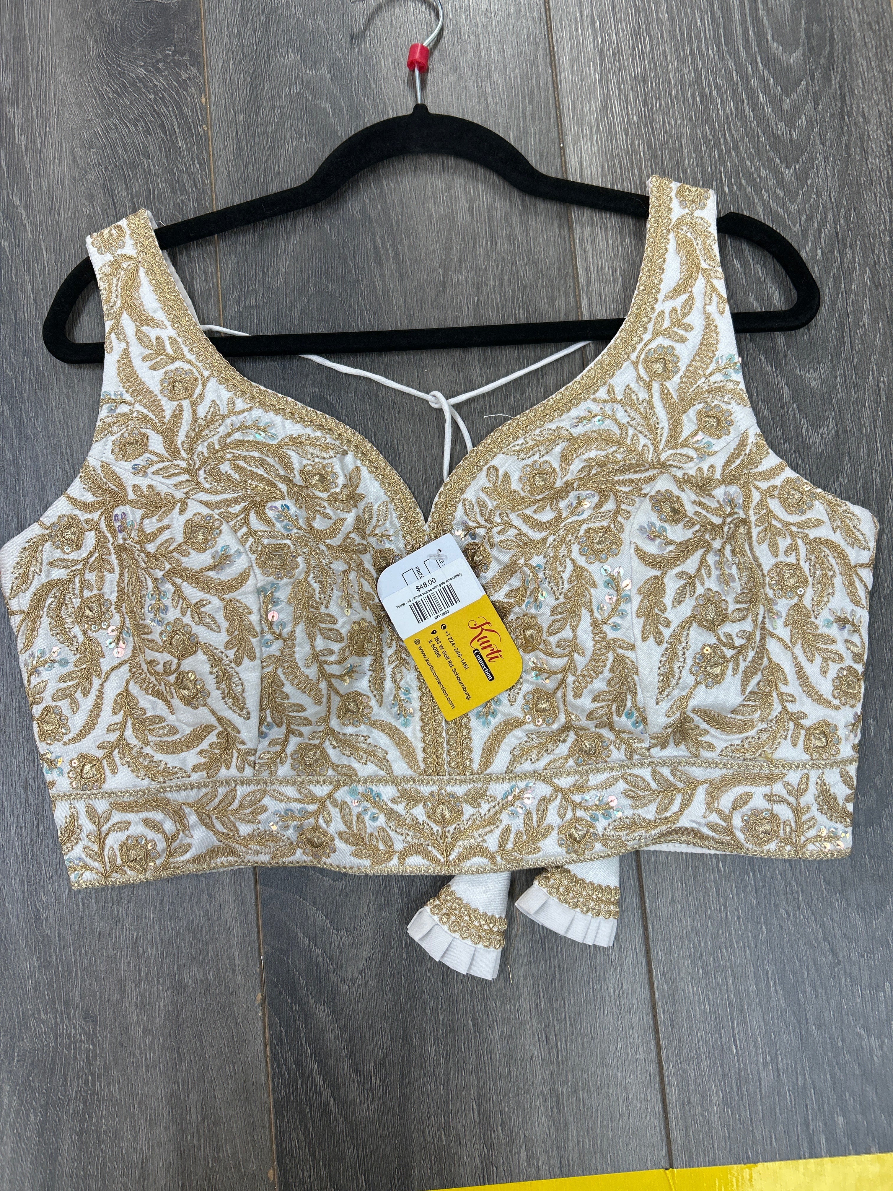 White blouse with gold embroidery