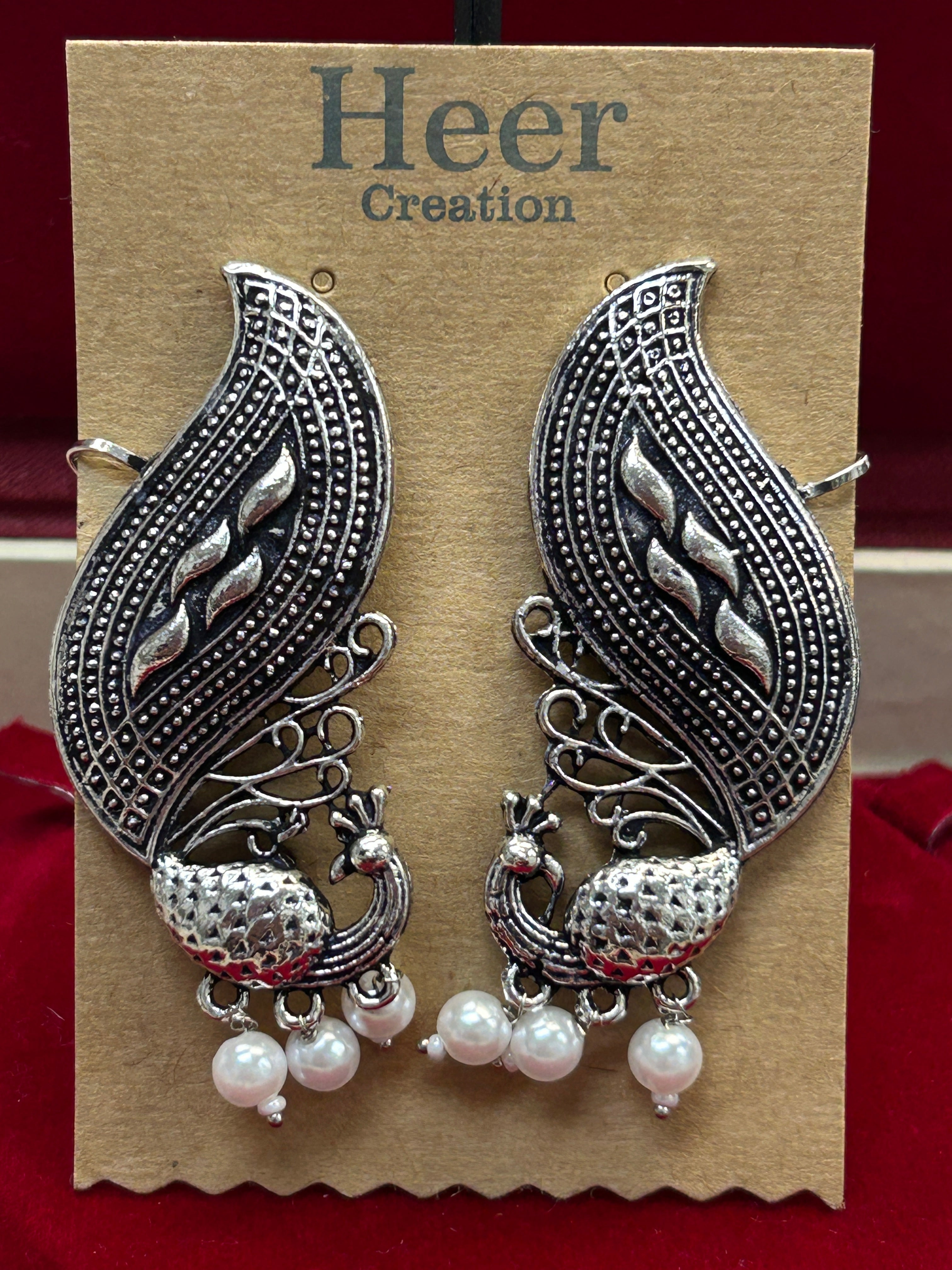 Peacock earrings: earcuffs