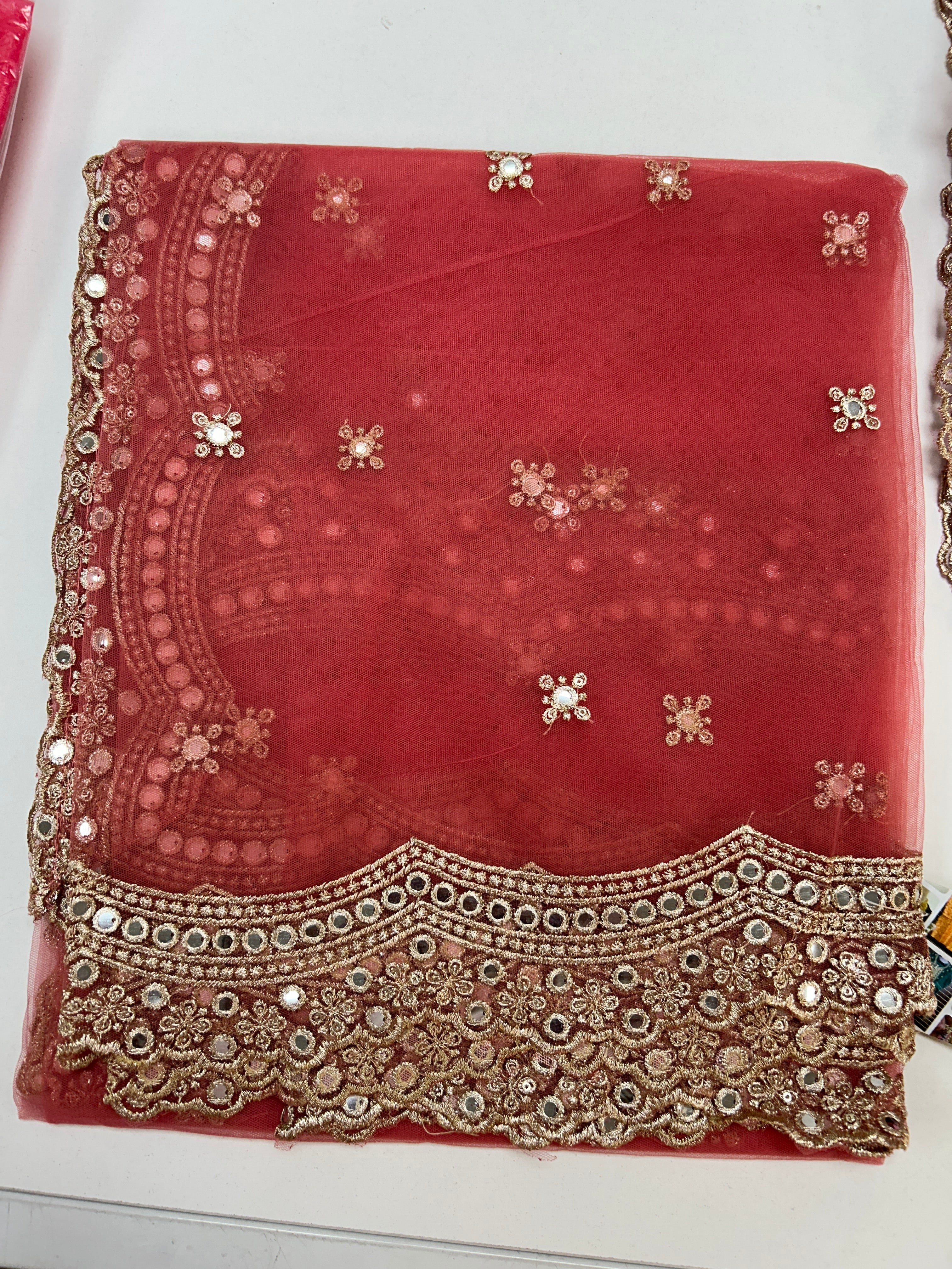 Peach pink net duppata with mirror work border