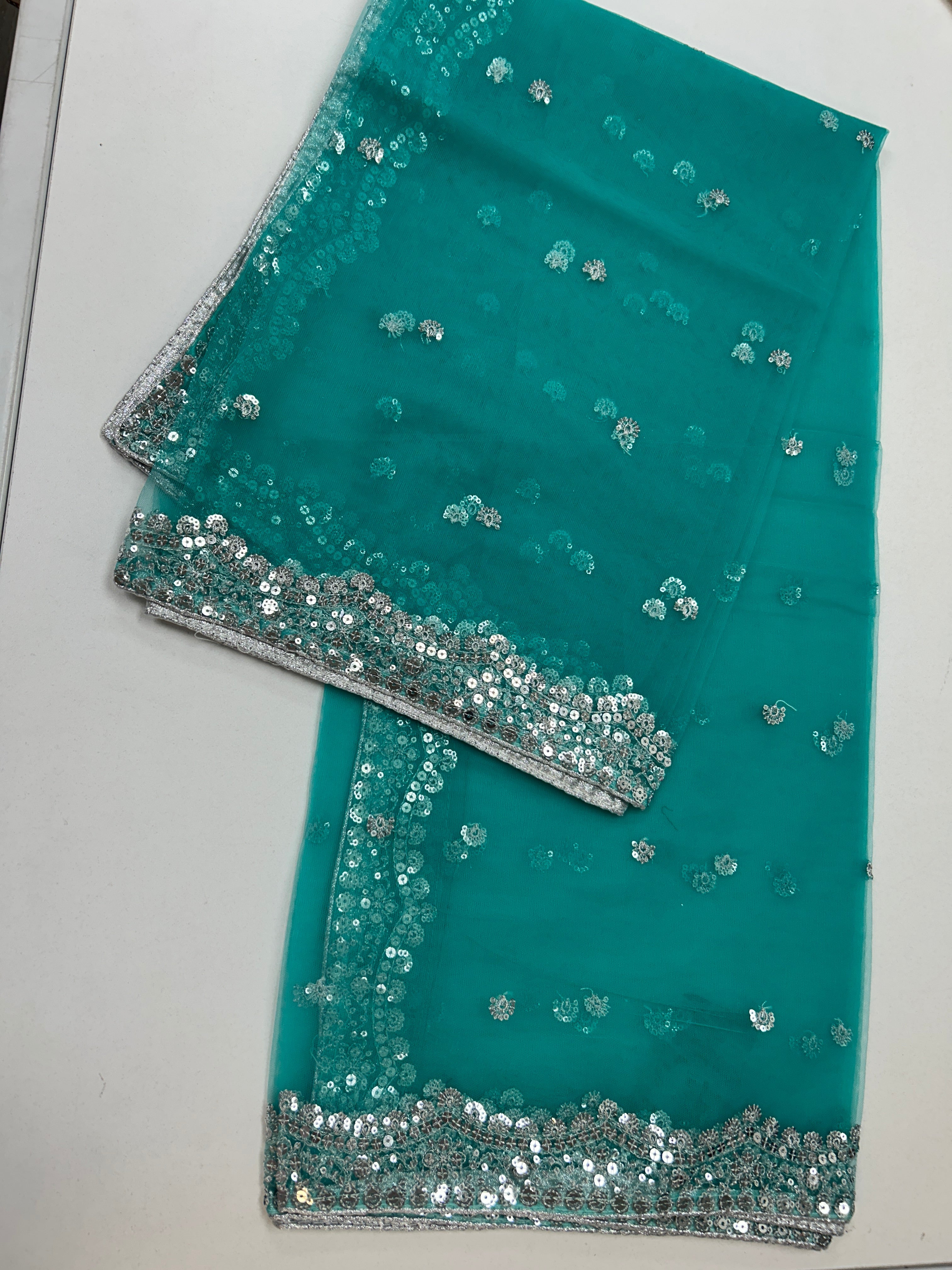 Sea  green net duppata with silver sequence work