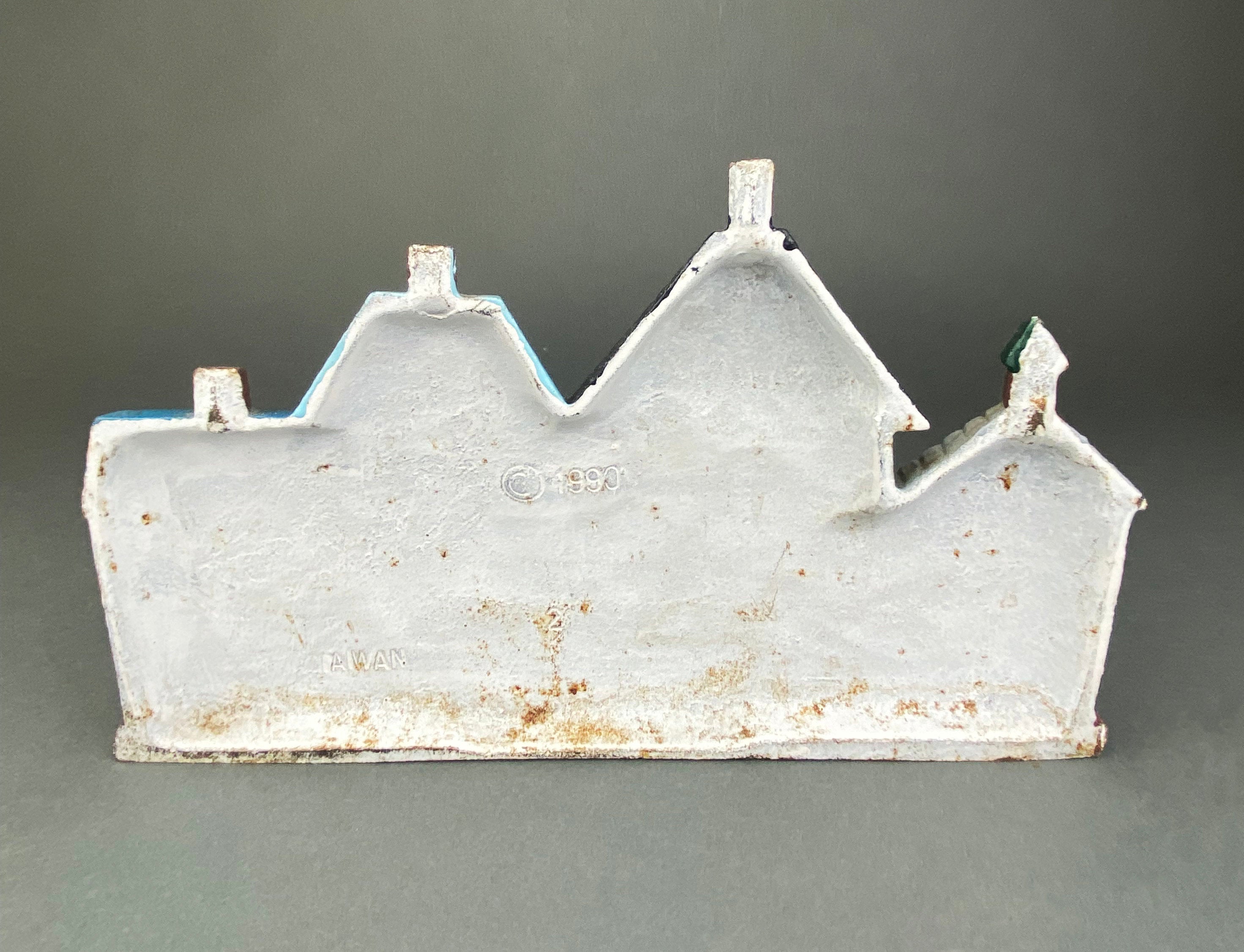 Vintage Cast Iron Door Stopper Shaped like Row of Houses