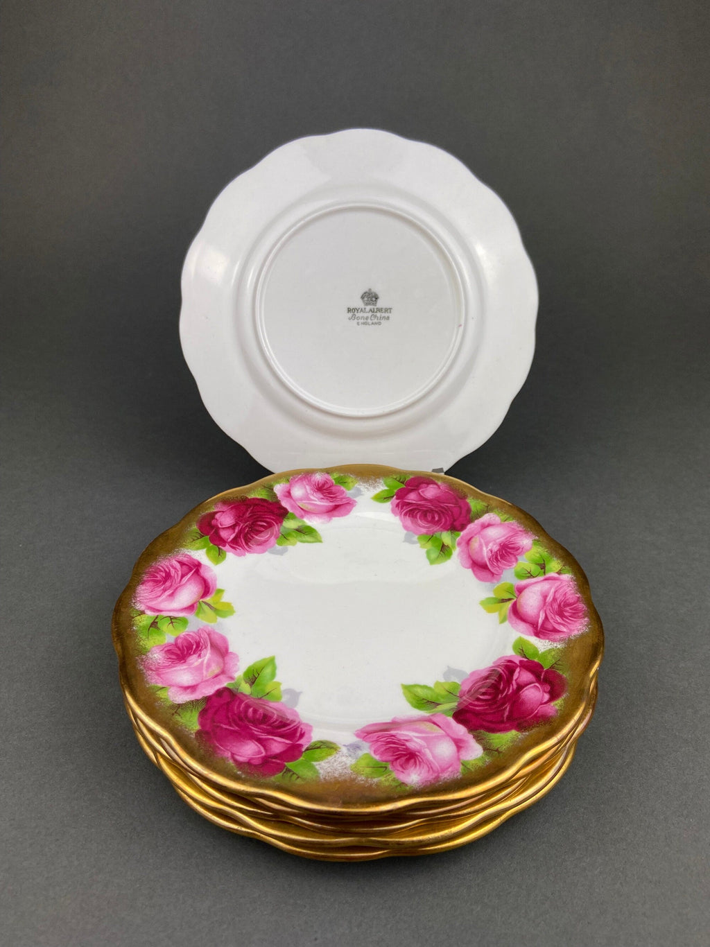Royal Albert Set of Six Dessert Plates and One Serving Plate  with Old English Rose Pattern.  Made in England.