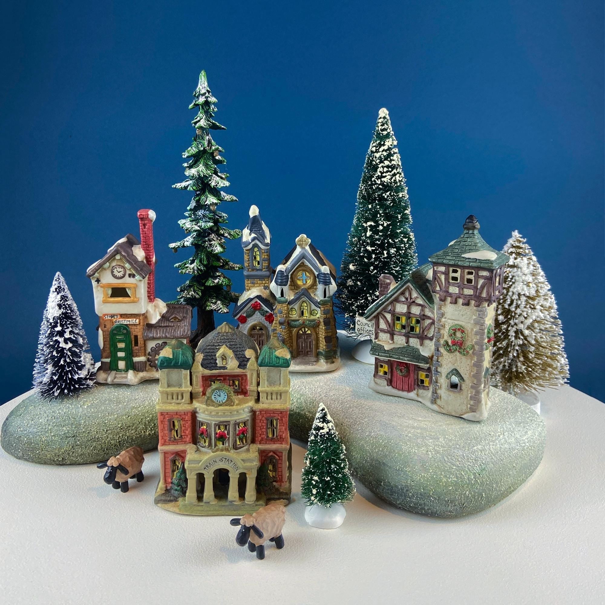 Christmas Village Collection of Small Illuminated Houses. Set of 4 Bldgs: Mill, 2 Churches, Train St., Council Offices, 2 Sheep and 3 Pines.