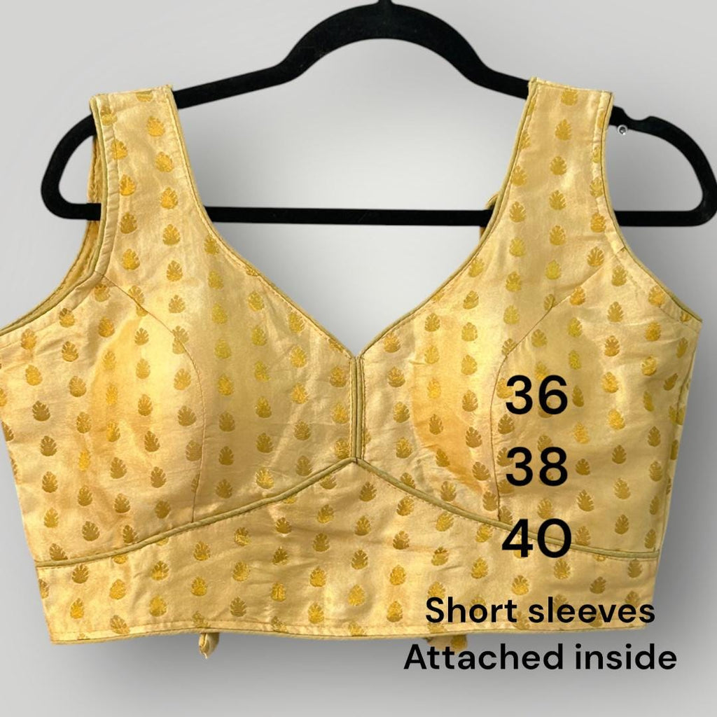 Sleeveless gold blouse