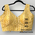 Sleeveless gold blouse