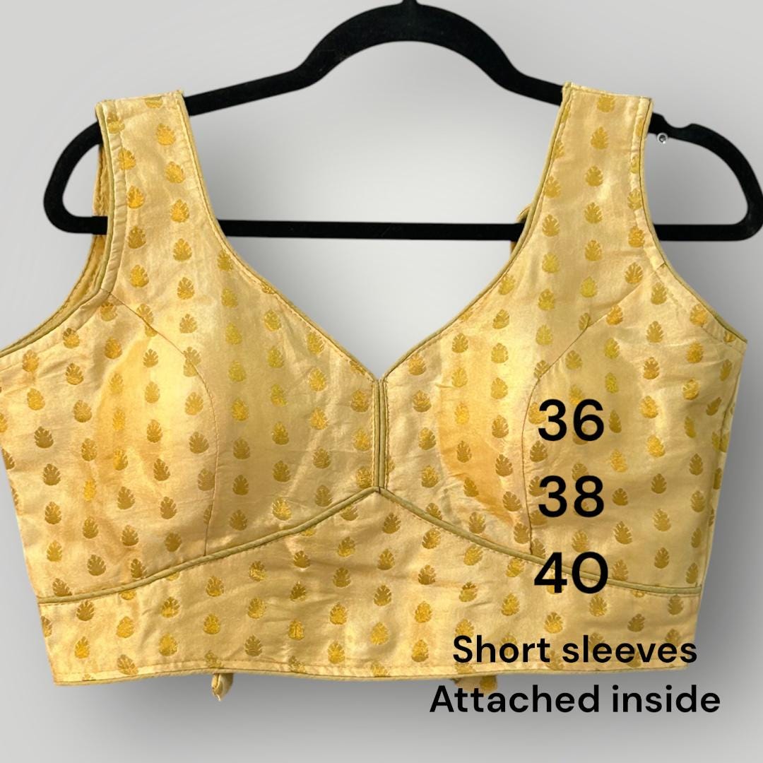 Sleeveless gold blouse
