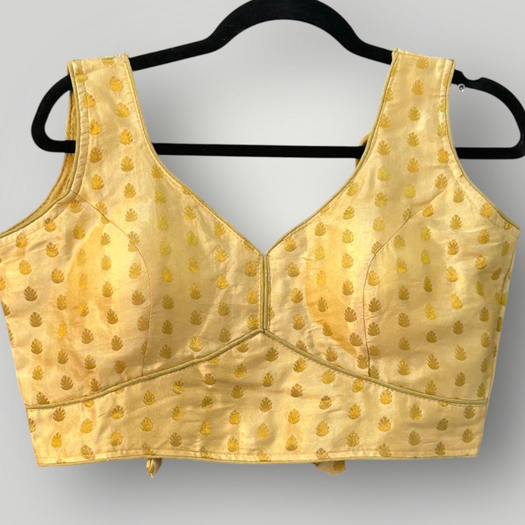 Sleeveless gold blouse