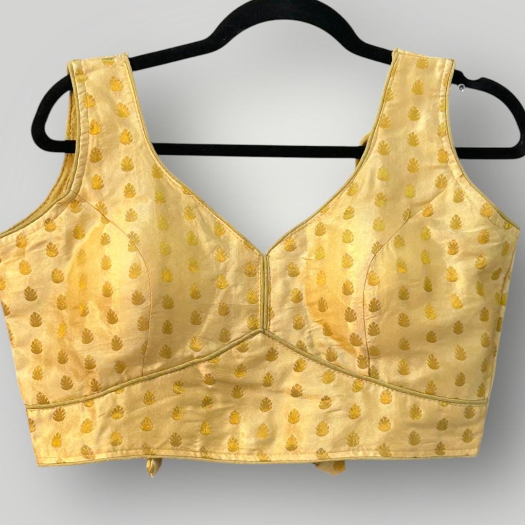 Sleeveless gold blouse