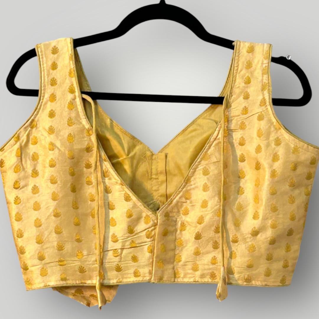 Sleeveless gold blouse