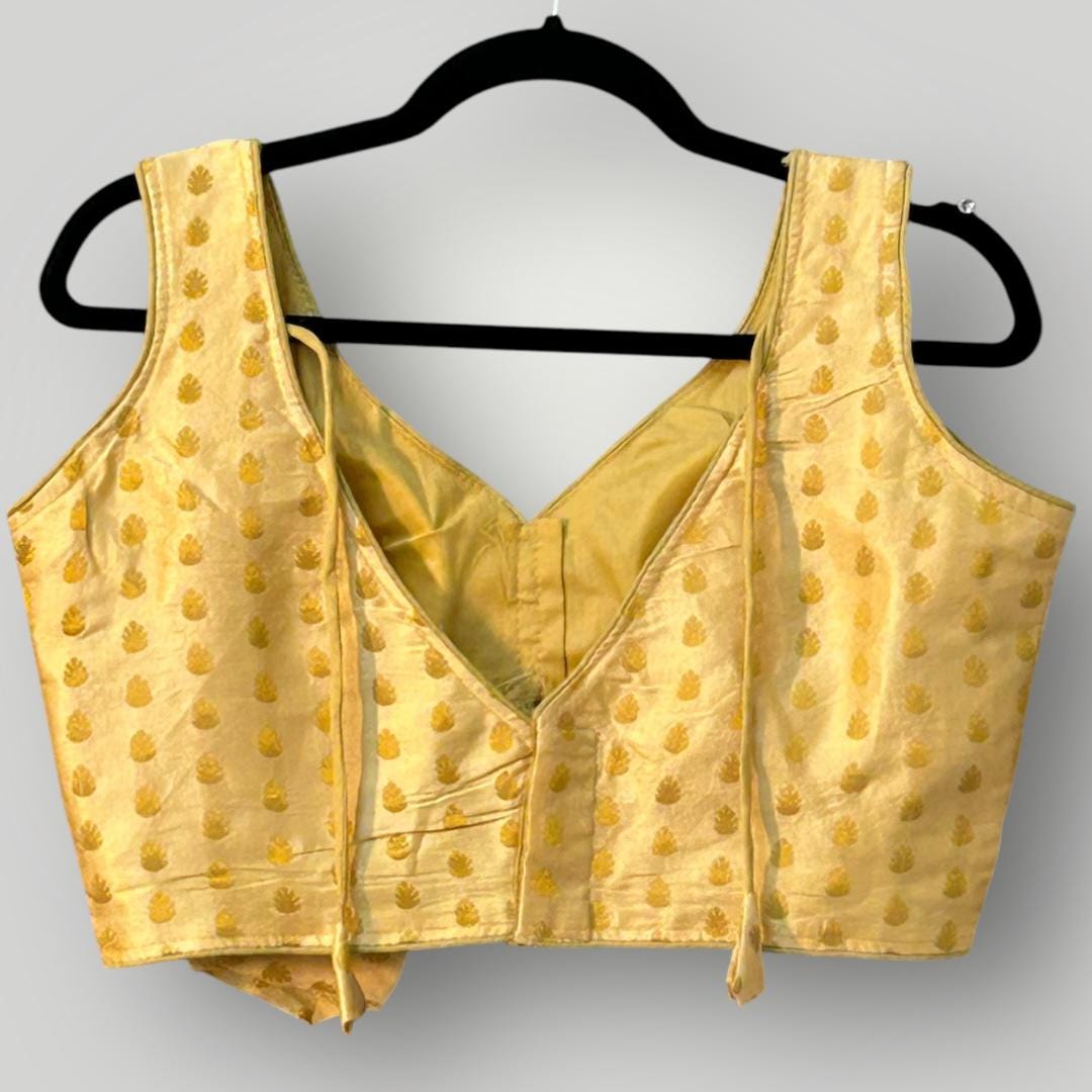 Sleeveless gold blouse